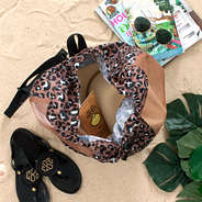 inside of cheetah monogrammed beach backpack bag