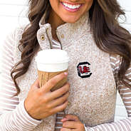 detail of gamecocks logo on heathered quilted vests