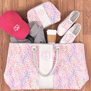 watercolor weekender with cosmetic case and sneakers