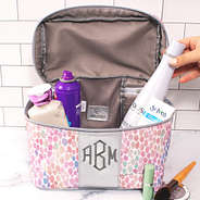 inside monogrammed watercolor train case with toiletries