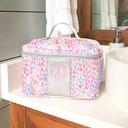 monogrammed watercolor train case on bathroom counter