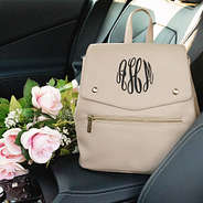 taupe grey backpack purse in car