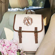 ivory backpack purse in car