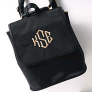 black monogrammed backpack purse