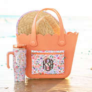 coral floral waterproof monogrammed beach bag in sand