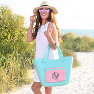 girl holding monogrammed waterproof tote