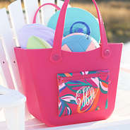 personalized waterproof beach bag in pink island sunset on beach chair