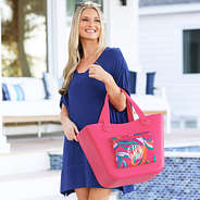 pink island sunset monogrammed waterproof beach bag over arm