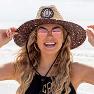 close up of monogrammed cheetah straw hat