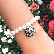 silver cross bracelet with flowers