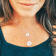 initial necklace layered with monogrammed necklace