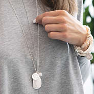 silver oyster necklace with gray shirt