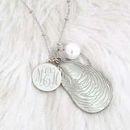 detail shot of silver oyster necklace