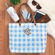 items spilled out of large tote with cognac monogram
