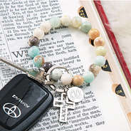 Monogrammed Cross and Bead Keychain on bible