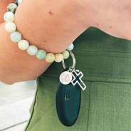 Monogrammed Cross and Bead Keychain on wrist