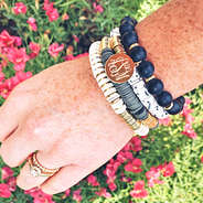 monogrammed beaded bracelets with pink flowers in background