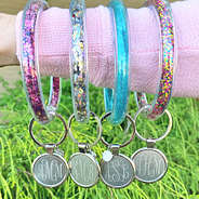 monogrammed confetti key rings on arm