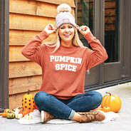 orange corded sweatshirt with pumpkin spice applique