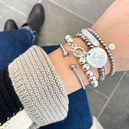 silver monogrammed ball bracelet with cardigan and booties