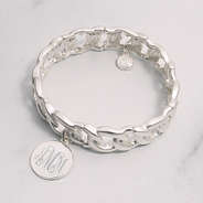 silver monogrammed stretchy bracelet on marble