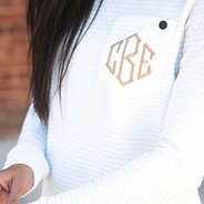 close up of monogrammed quilted sweatshirt