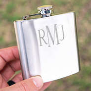 silver flask being held