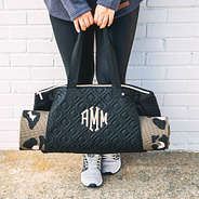black quilted gym bag with yoga mat
