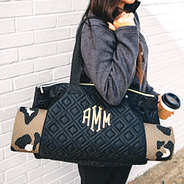 monogrammed quilted gym bag on shoulder