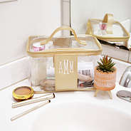 monogrammed clear train case in bathroom