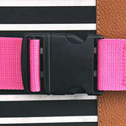 buckle of monogrammed luggage strap