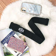 black monogrammed luggage strap with buckle