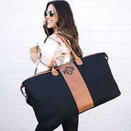 monogrammed travel bag over shoulder