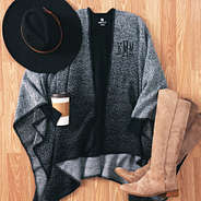 monogrammed black and white poncho outfit