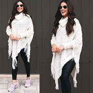fringe poncho sweater styled for athleisure with sneakers