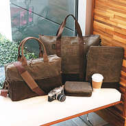 personalized waxed bag collection on bench