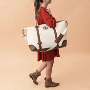 ivory vintage weekender on shoulder - 2024
