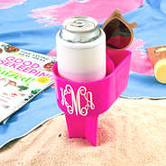 monogrammed sand buddy in sand and towel