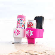 sand buddy in white and hot pink holding things