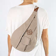 taupe sling pack on back