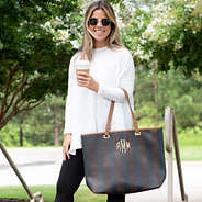 monogrammed striped tote bag on arm