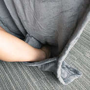 holes for feet in packable travel blanket