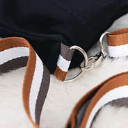 close up of clasp on monogrammed quilted crossbody tote