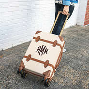 vintage monogrammed carry on luggage being rolled on wheels- NEW