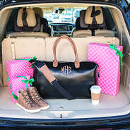 monogrammed overnighter in trunk with gifts