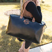 monogrammed overnighter on shoulder