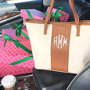 monogrammed canvas stripe tote in car with gifts
