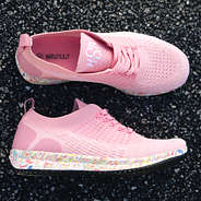 monogrammed confetti sneakers on pavement