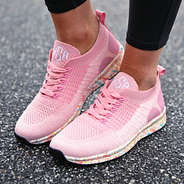 angled shot of monogrammed confetti sneakers