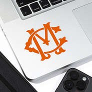 Initial crest in orange on inside corner of laptop